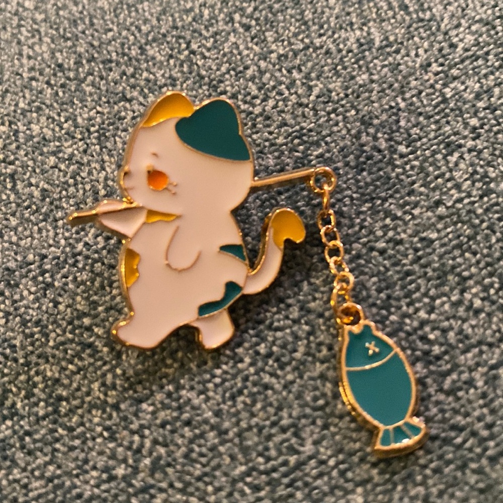Adorable kawaii cute Green & white cat w/dangling fish on pole enamel pin